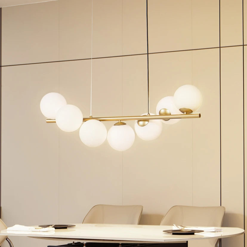 Lucande Hängeleuchte Isandro, 95 cm, gold, weiß, 7-flg