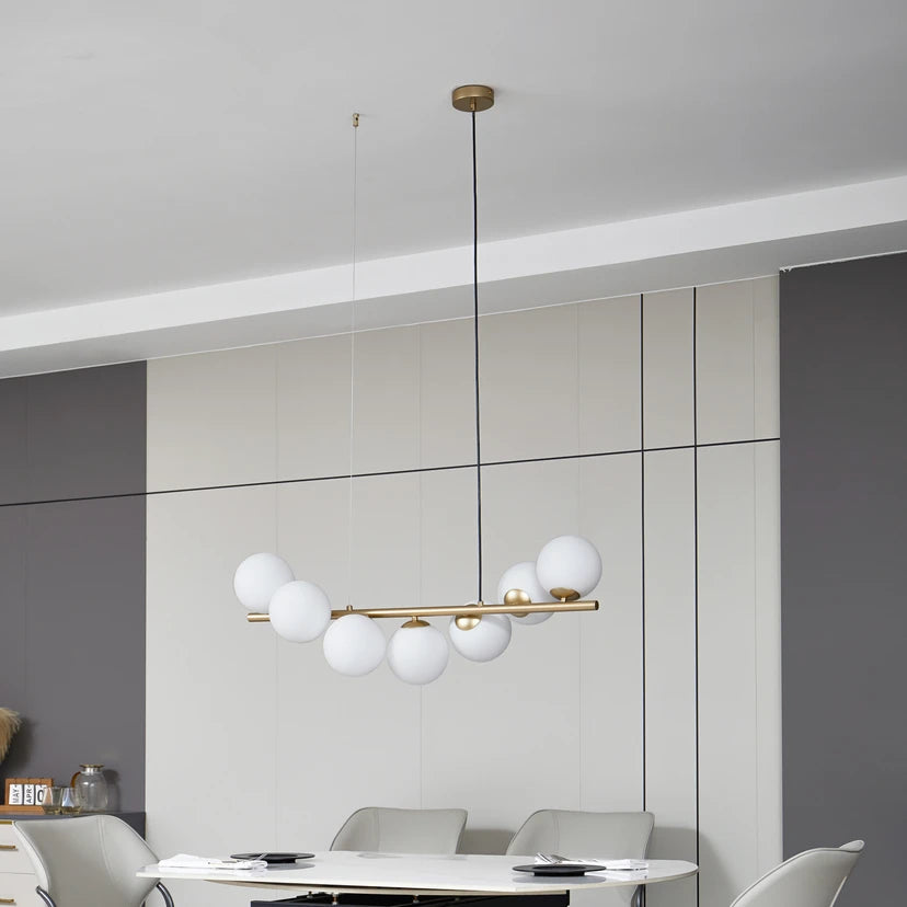 Lucande Hängeleuchte Isandro, 95 cm, gold, weiß, 7-flg